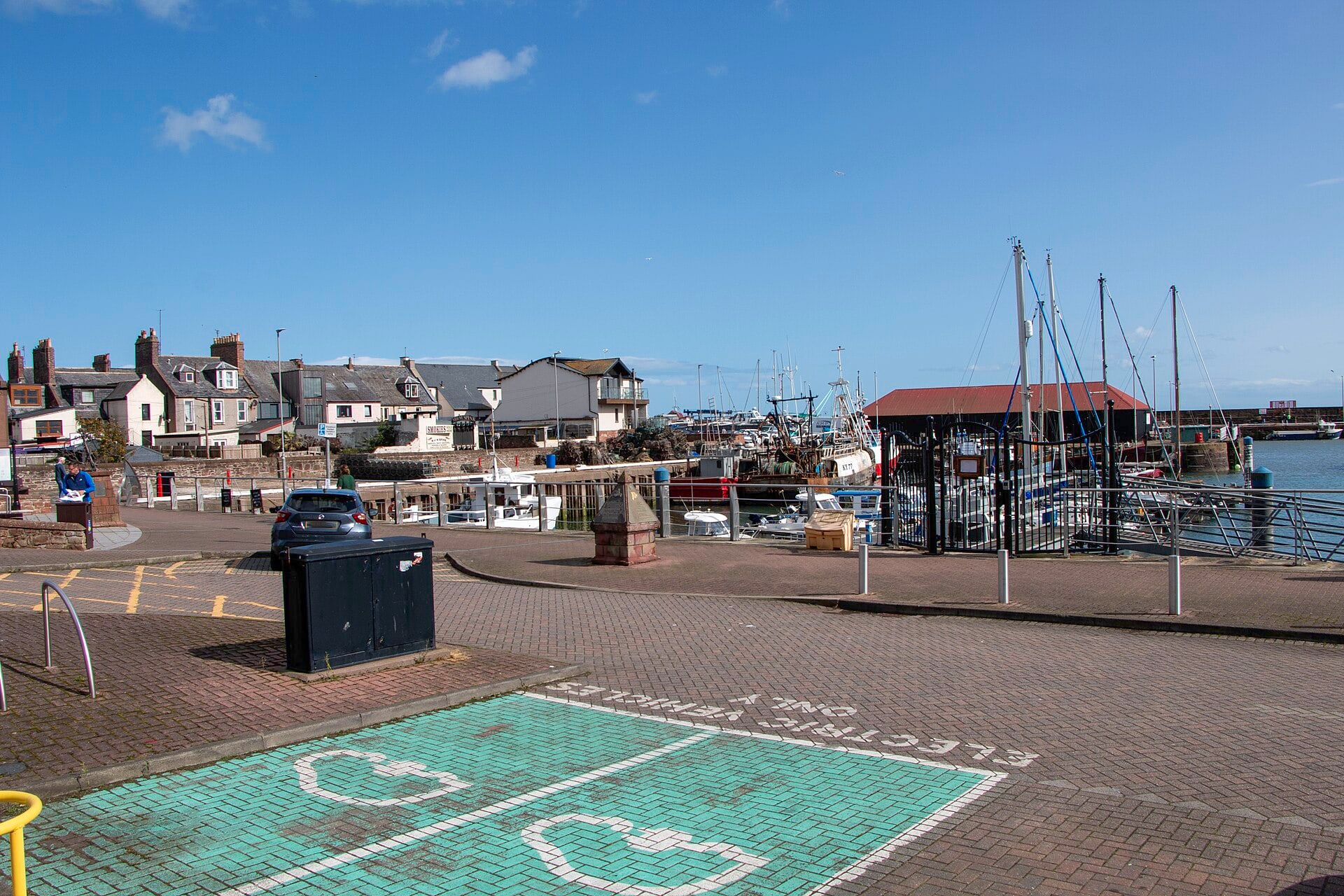 Boats and traditional buildings at Arbroath Harbour in Angus